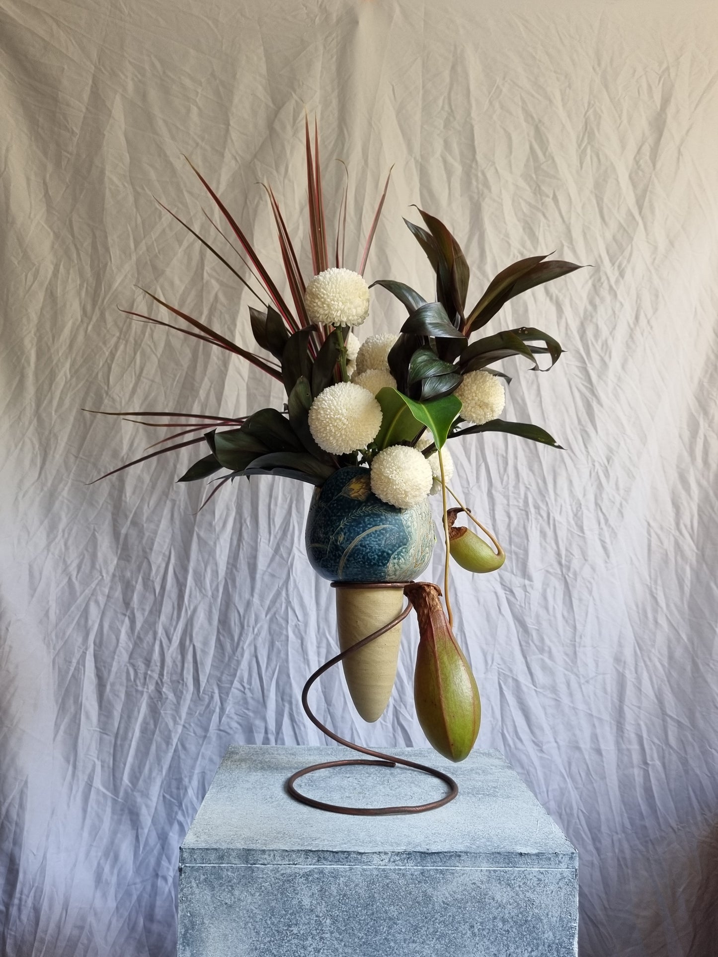 A tropical floral sculpture in a vase, designed as a sweet, artistic gesture for the home by foRM of Mondays
