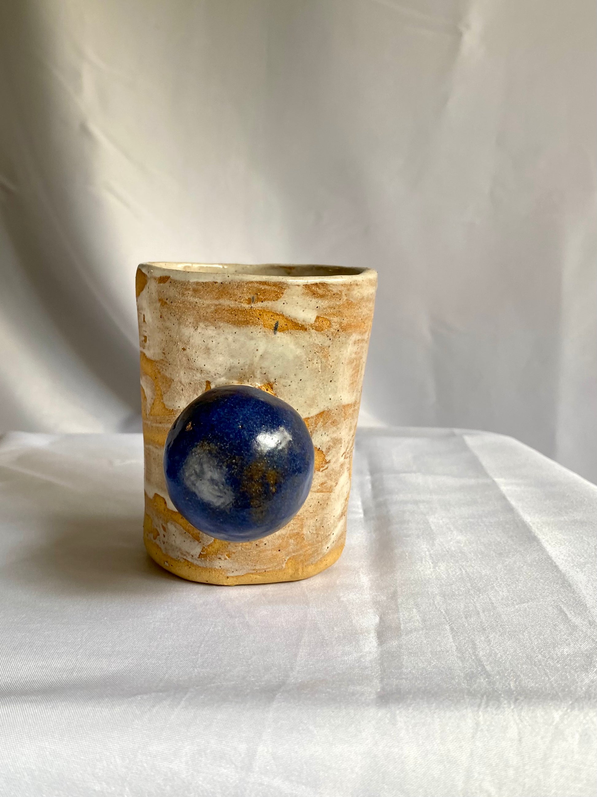 Interesting Ceramic cup with a blue sphere handle by foRM of Mondays 