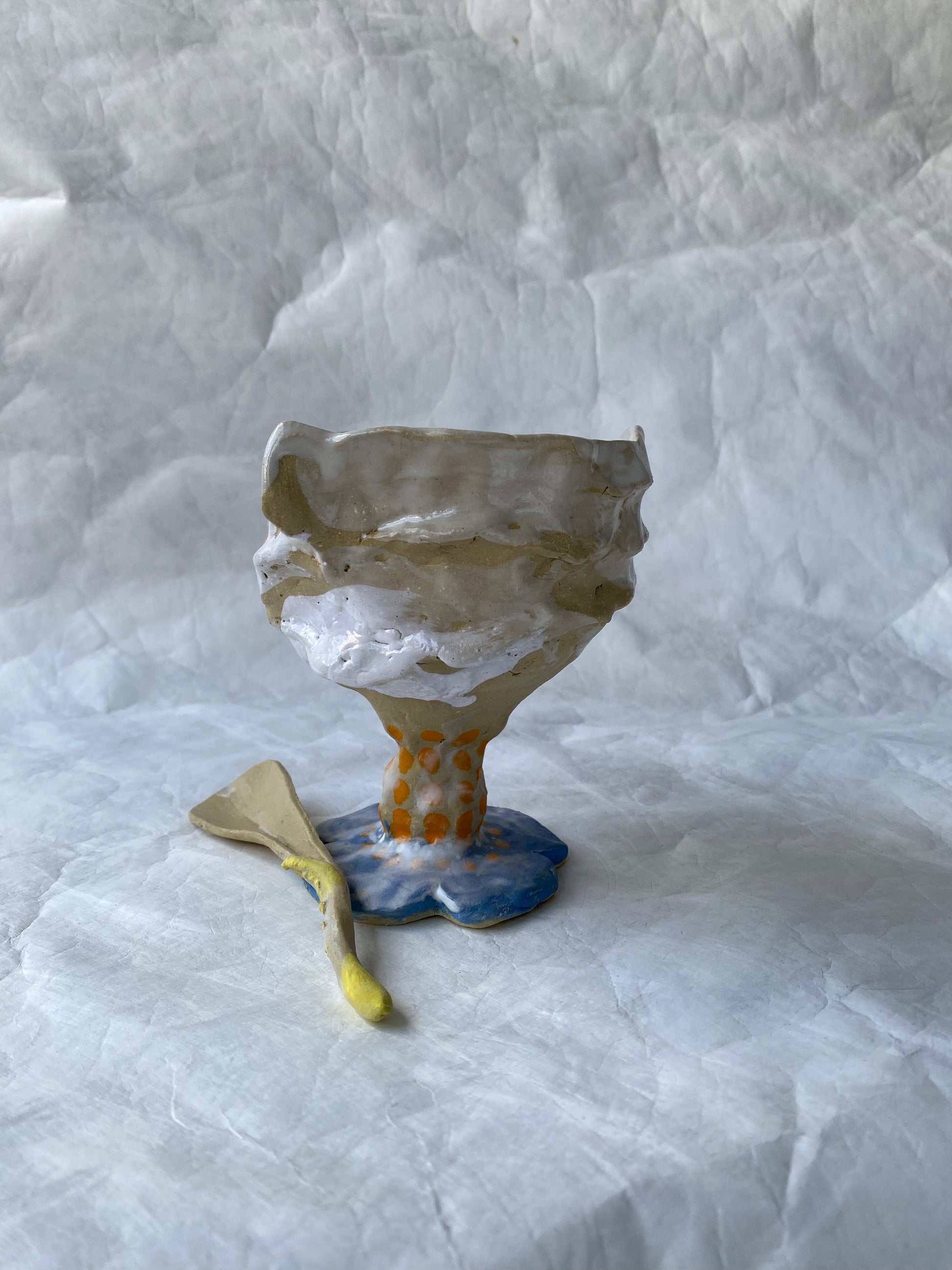 A hand-built sundae cup with raw textures and imperfect edges, part of the foRM of Mondays sculptural signature objects for tactile connections 
