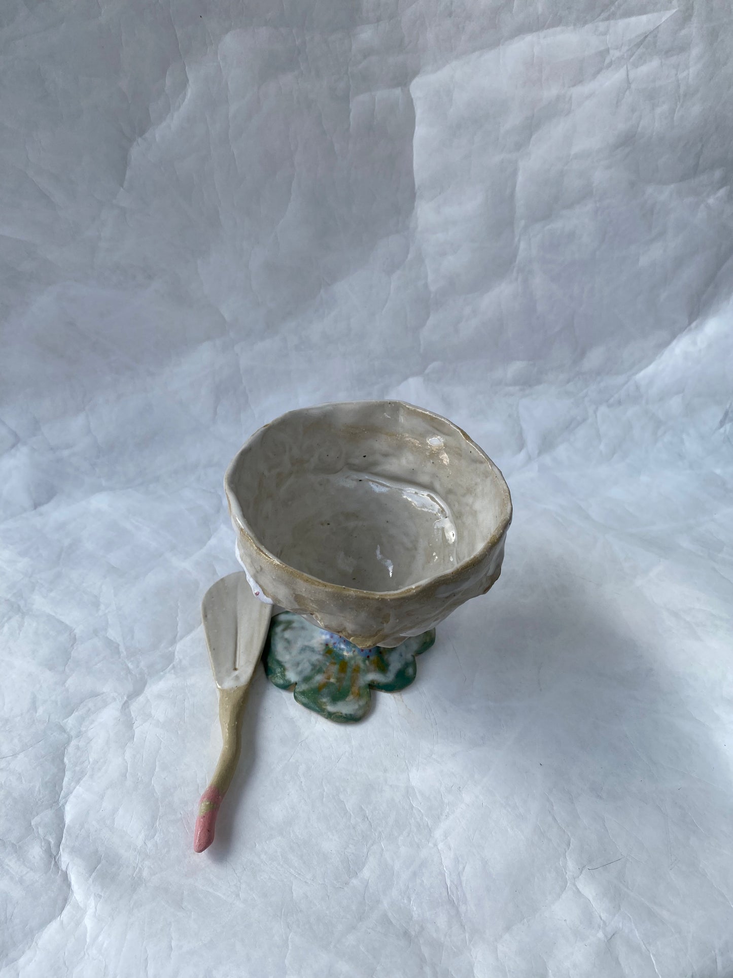 A hand-built set of ceramic sundae cup and spoon,  inspired by nature’s imperfections, by foRM of Mondays Singapore.