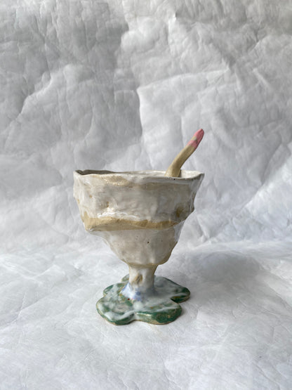 A hand-built set of ceramic sundae cup and spoon,  inspired by nature’s imperfections, by foRM of Mondays Singapore.