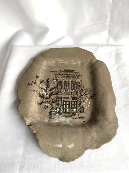 Hand-painted ceramic plate featuring Singapore shophouse architecture, artisan heritage flatware by foRM of Mondays.