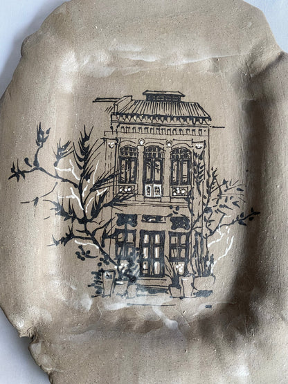 Hand-painted ceramic plate featuring Singapore shophouse architecture, artisan heritage flatware by foRM of Mondays.