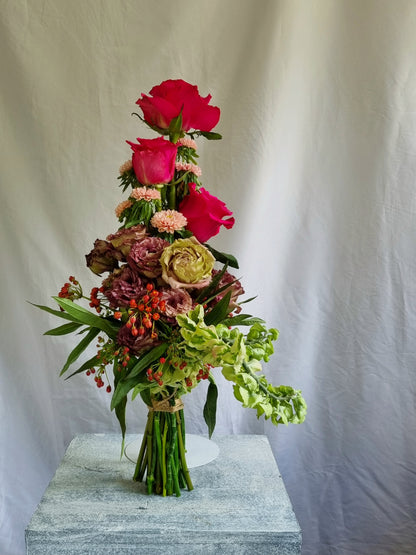 A sculptural floral composition by foRM of Mondays, featuring curated seasonal ingredients and a distinct, organic form.
