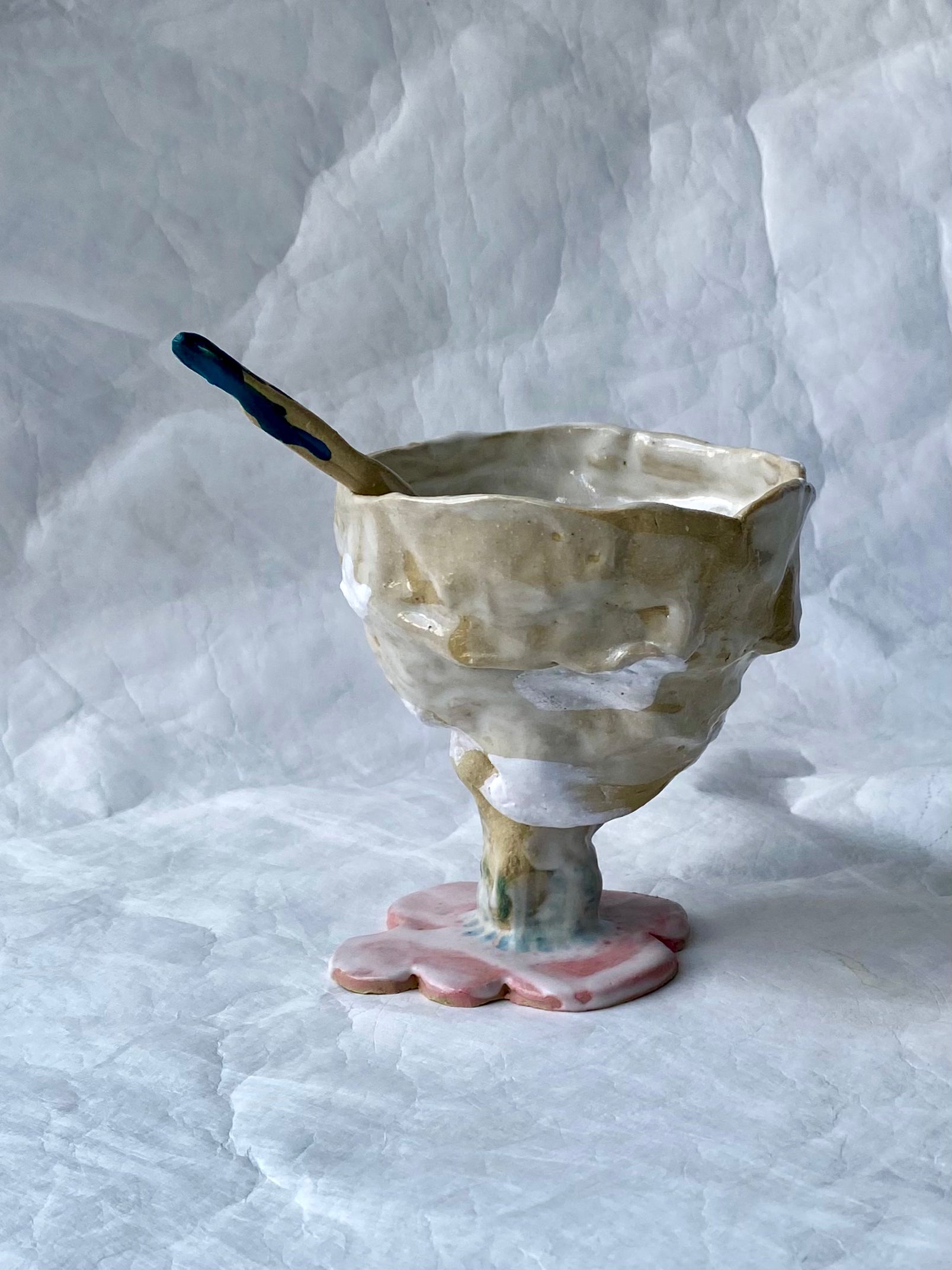 A hand-built set of ceramic sundae cup and spoon,  inspired by nature’s imperfections, by foRM of Mondays Singapore.