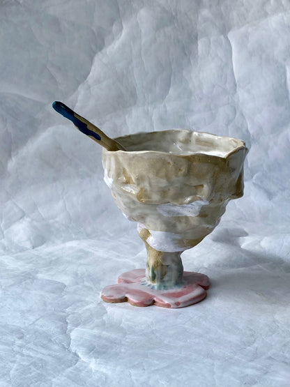 A hand-built set of ceramic sundae cup and spoon,  inspired by nature’s imperfections, by foRM of Mondays Singapore.