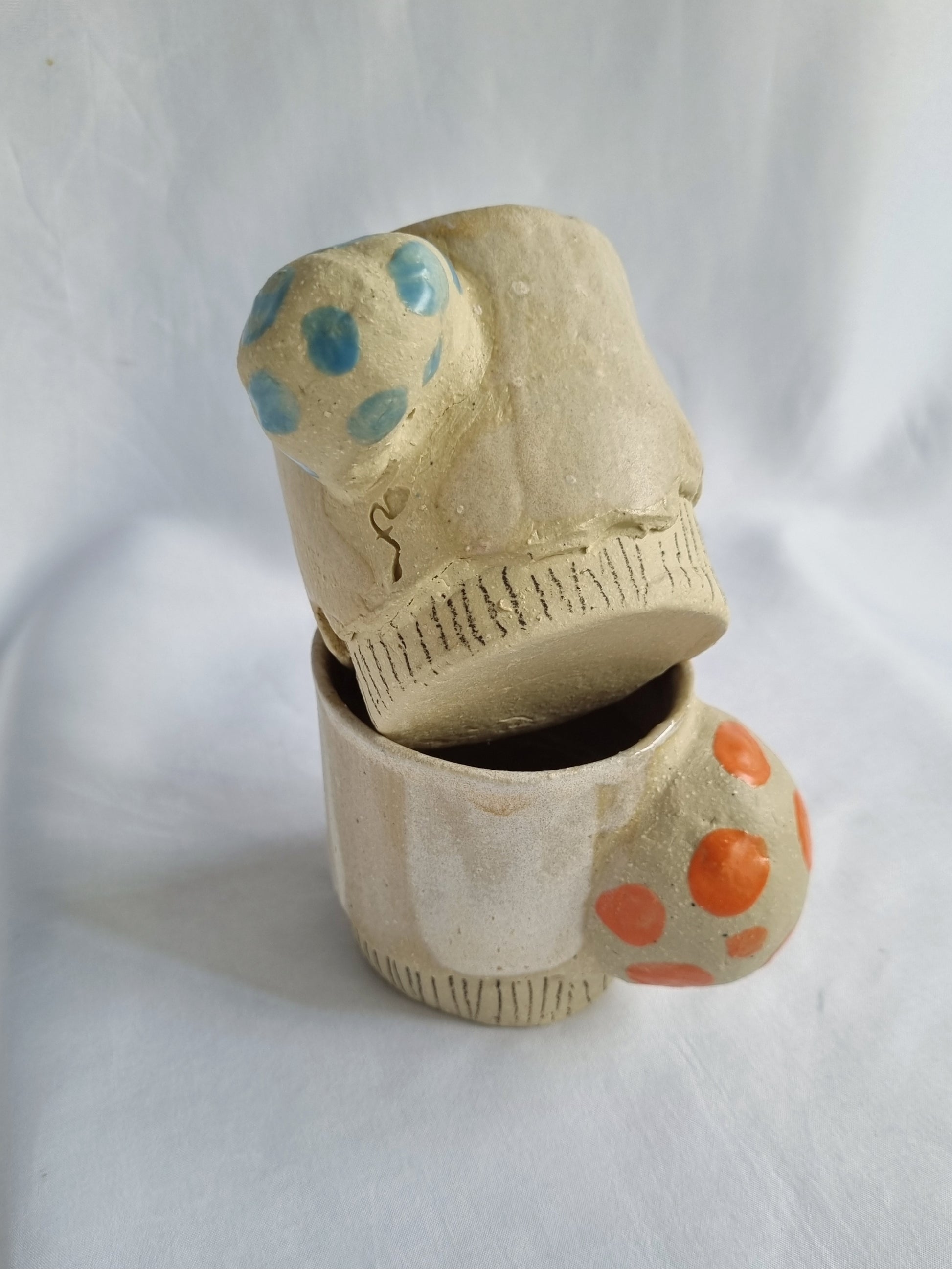 One off ceramic cups, tactile with integrated bell 