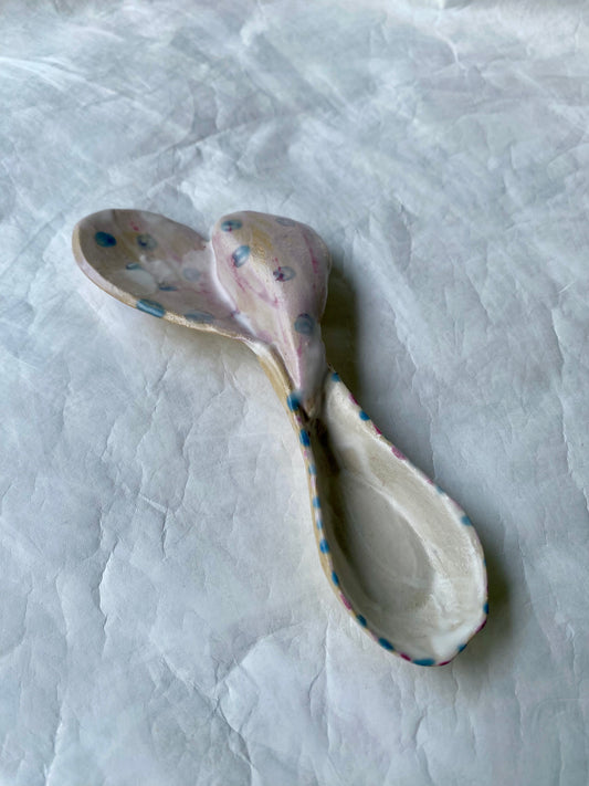 One off, hand-built ceramic spoon with a heart shaped decoration and “scoop of love” imprinted 