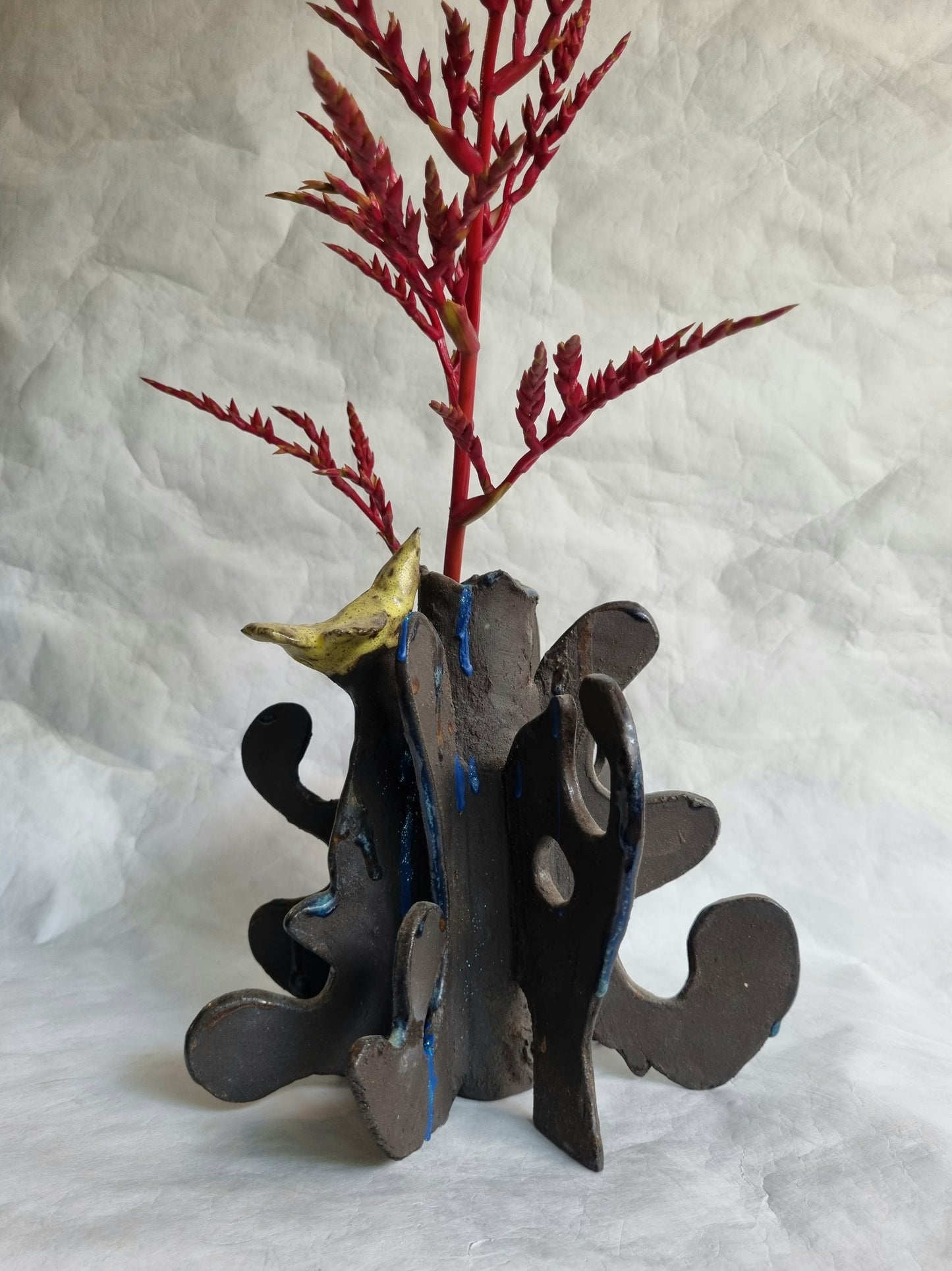 A limited-series ceramic vessel from the Sunbirds Collection by foRM of Mondays, featuring organic, highly textured clay work with abstract references to a kinetic energy 