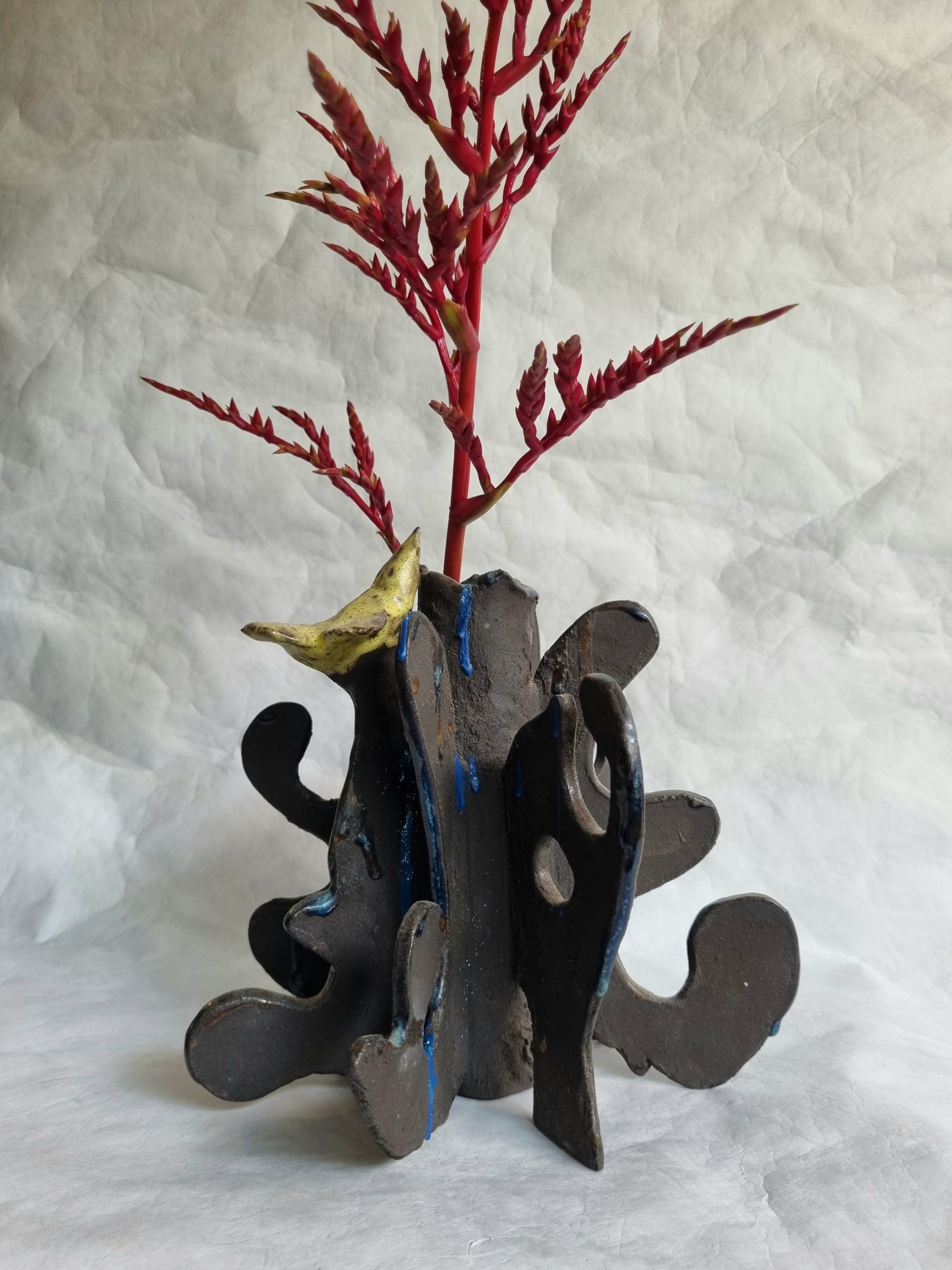 A limited-series ceramic vessel from the Sunbirds Collection by foRM of Mondays, featuring organic, highly textured clay work with abstract references to a kinetic energy 